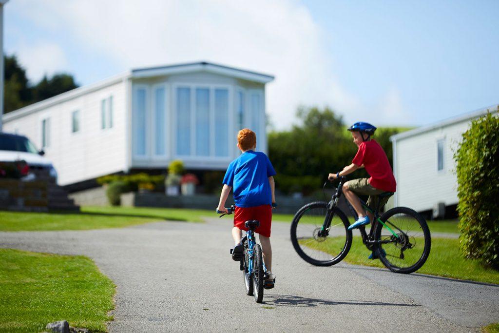 Children cycling around the park