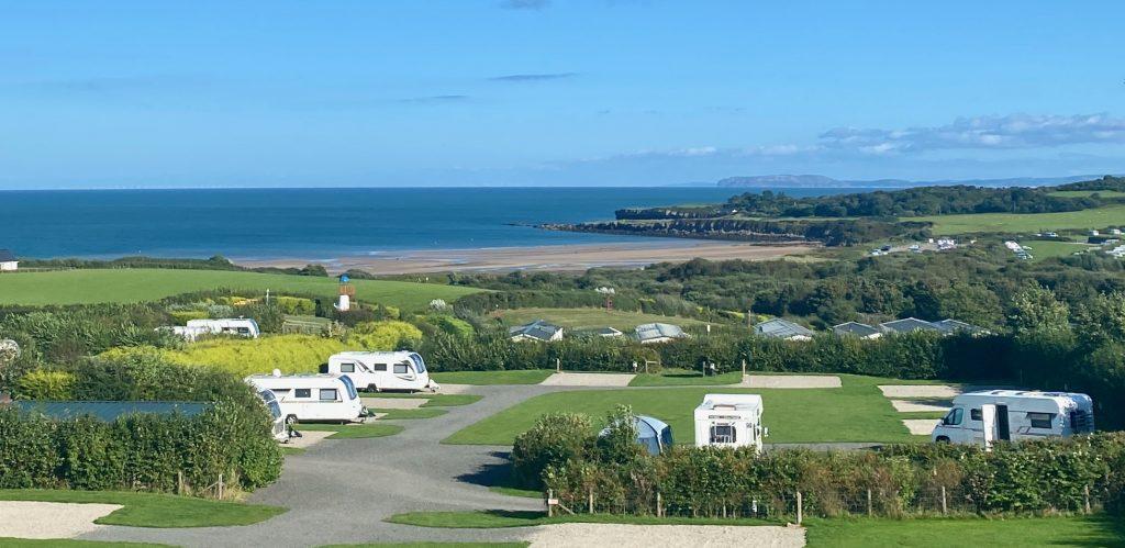 A view of the all-weather, road accessed pitches on Lower Red field with a view of Lligwy beach.