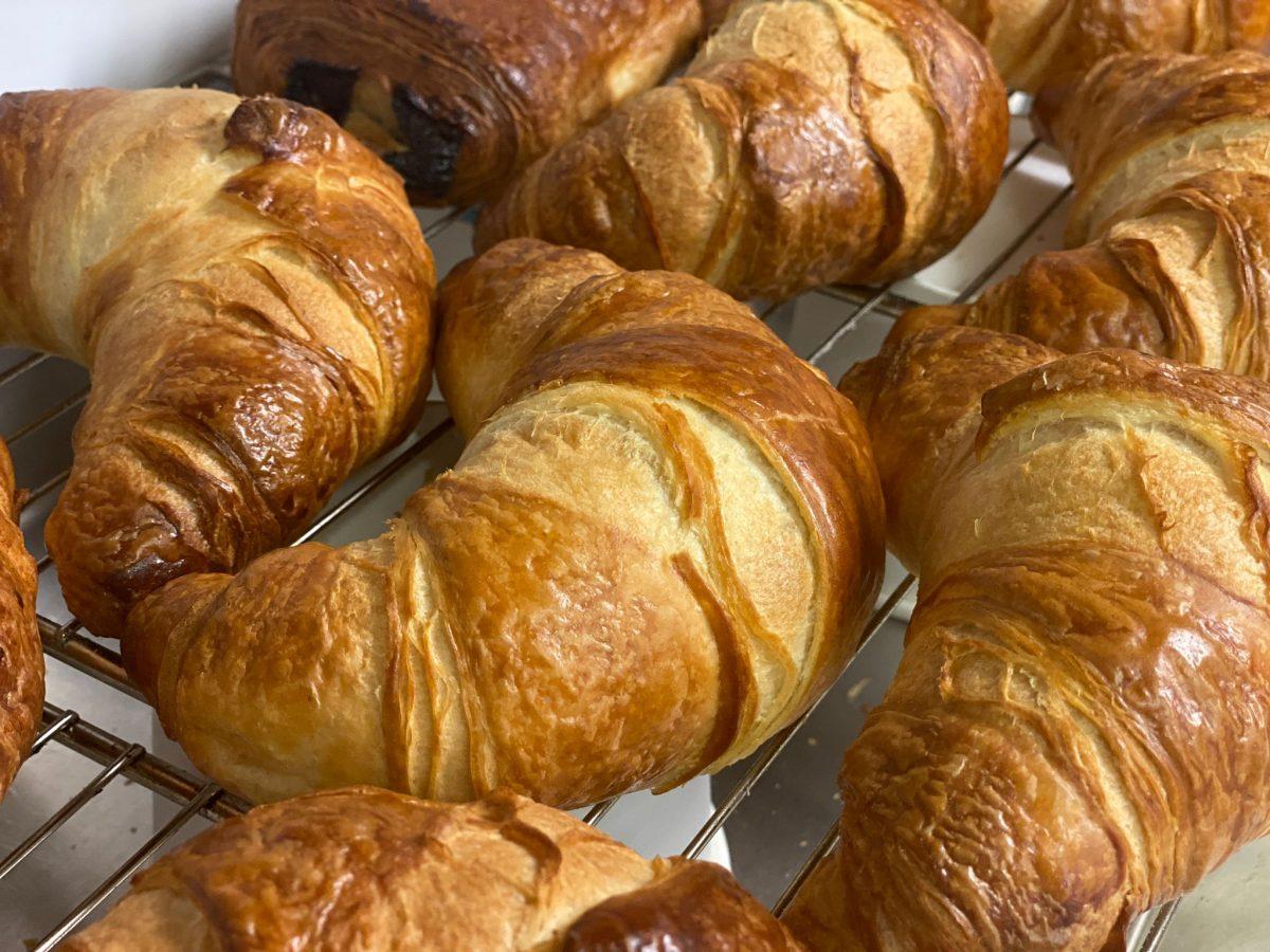 Freshly baked golden croissants that have been ordered by guests at Tyddyn Isaf Caravan Park